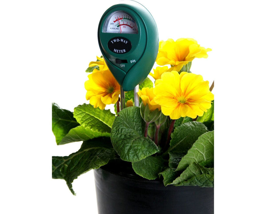 Analog 2-way soil meter by Active Air showing pH and moisture readings in a black flower pot.