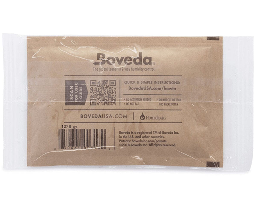 Back of a sealed Boveda 62% humidity control pack showing usage instructions, barcode, QR code, and website details printed on kraft paper.