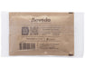 Back of a sealed Boveda 62% humidity control pack showing usage instructions, barcode, QR code, and website details printed on kraft paper.