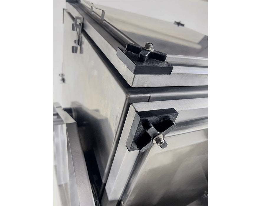 Interior view of the Alchemist 420 extractor showing smooth stainless steel walls and bottom screen area.