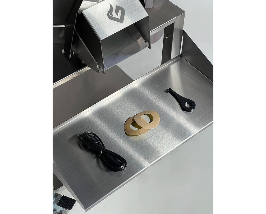 Accessories included with the GreenBroz M1 Trimmer, shown on metal tray: power cord, spacers, and adjustment tool.