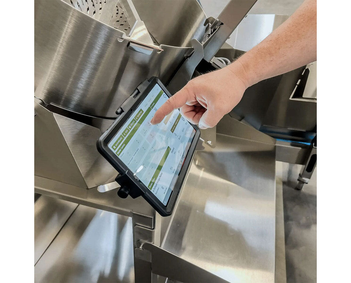 Persons finger touching the control screen of the GreenBroz M1 Plus GBZ Control Cannabis Processing System Trimmer  