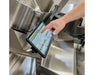 Persons finger touching the control screen of the GreenBroz M1 Plus GBZ Control Cannabis Processing System Trimmer  