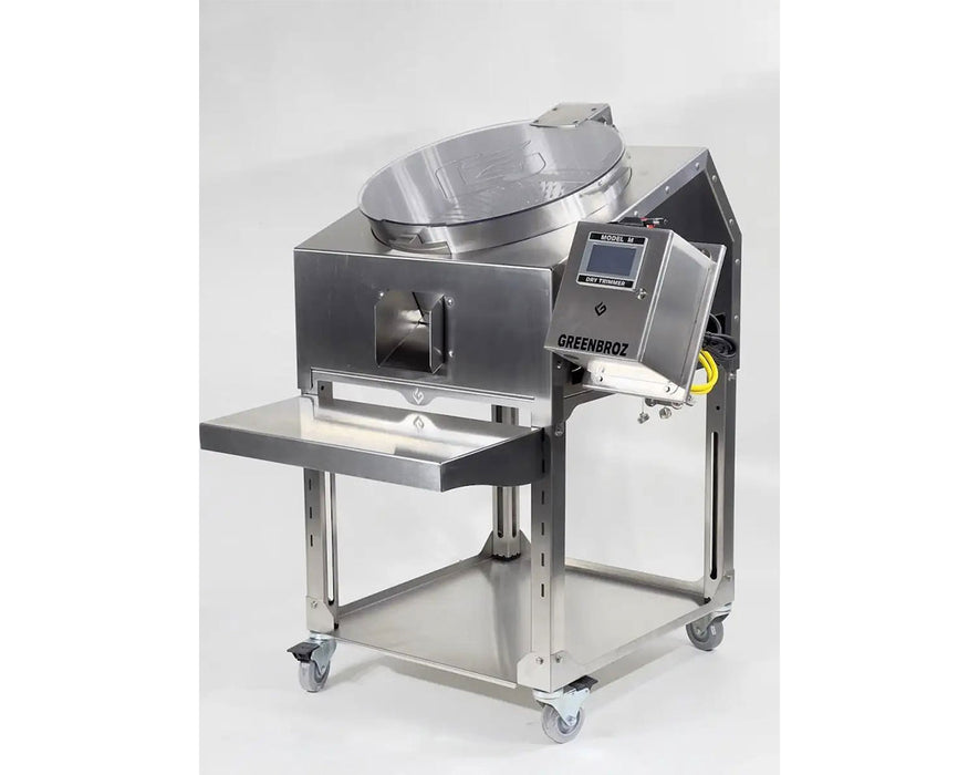 Side view of GreenBroz Model M Dry Trimmer showing clear lid, output chute, and touchscreen control interface.