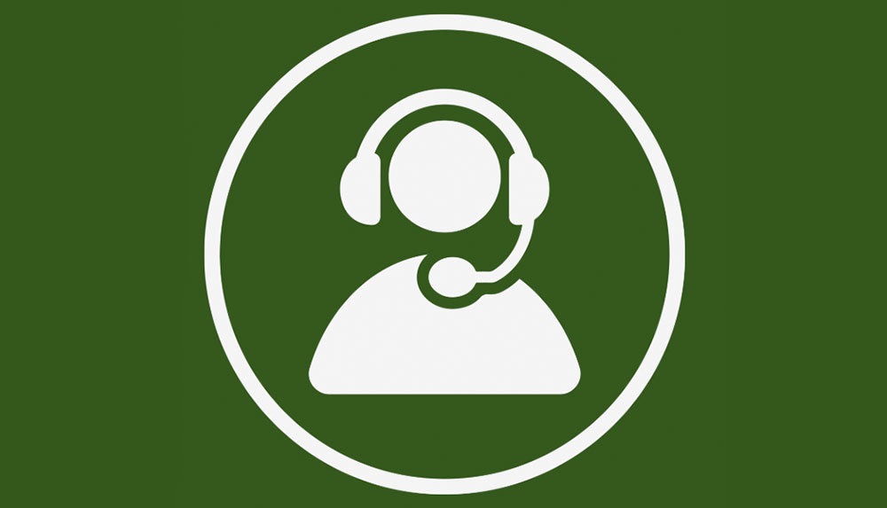 White customer support icon showing a person wearing a headset inside a circle, on a dark green background.