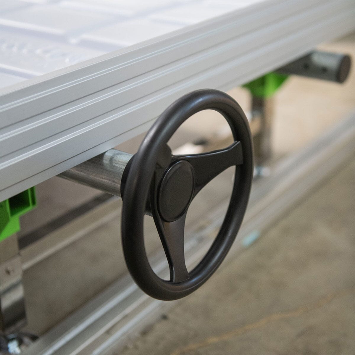 Close-up of the hand crank mechanism on the GrowPros 4′ Rolling Bench Gen II for easy lateral movement.