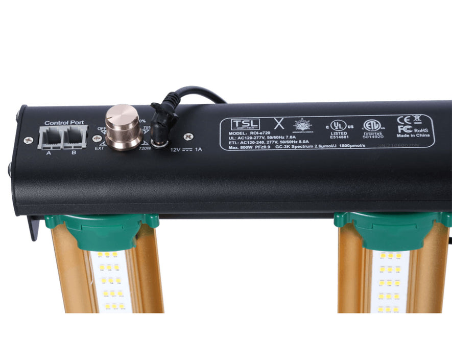 Close-up of Grower's Choice ROI-E720 LED grow light dimming knob, control ports, and power input.