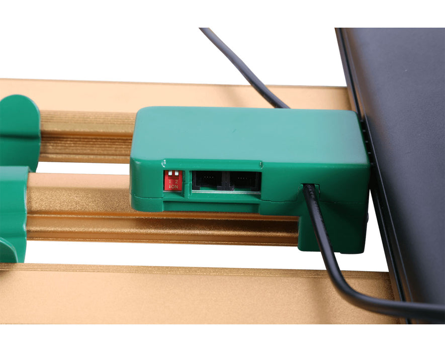Close-up of green controller housing with RJ ports and red DIP switches on ROI-E720 grow light.