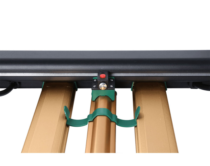 Close-up of the mounting clip securing the center UV-R bar to the frame with red and brass components.