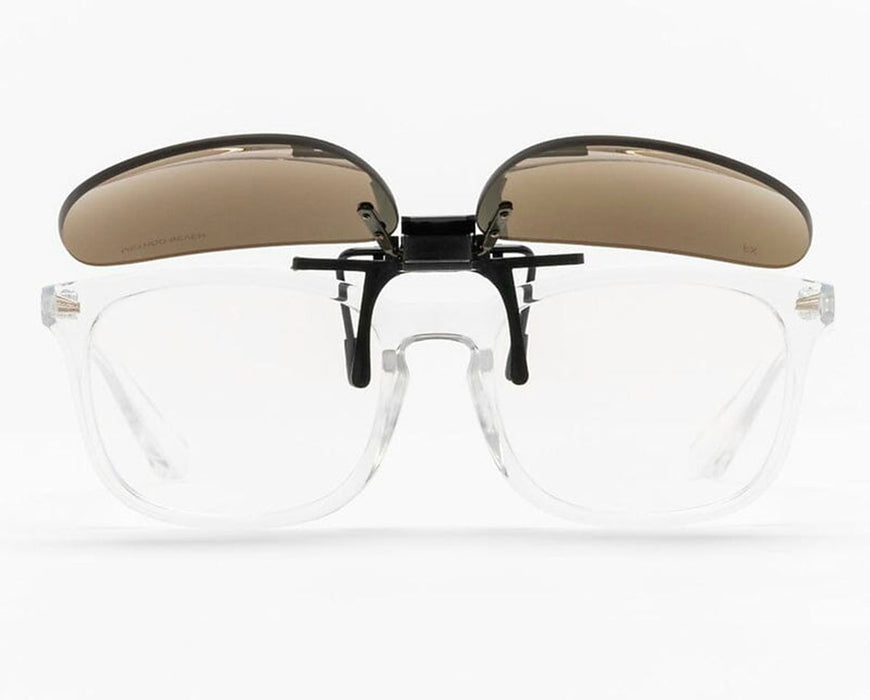Front view of FX2 clip-on lenses flipped up on clear prescription glasses.