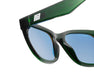 Close-up of Method Seven Coup HPS glasses showing green translucent frame, blue lenses, and etched branding.