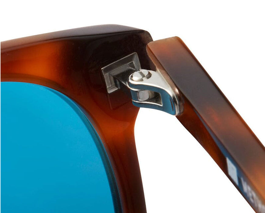 Close-up of metal hinge detail on Lennox sunglasses frame.