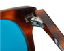 Close-up of metal hinge detail on Lennox sunglasses frame.