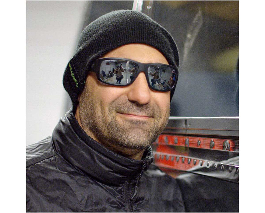 Man wearing Method Seven Resistance 2 HPS Crystal glasses indoors, reflecting grow room environment in lenses.
