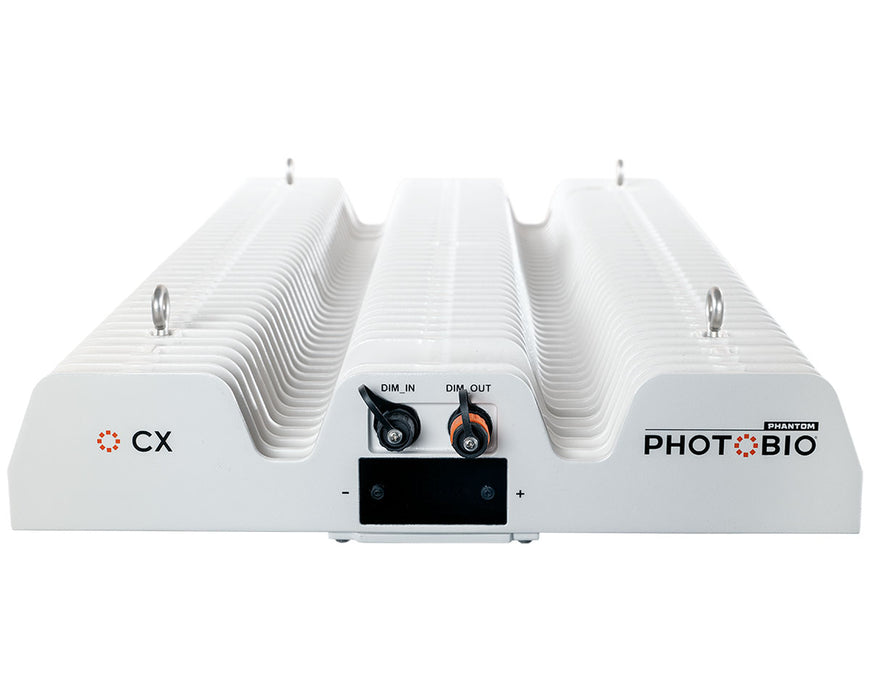 Front view of PHOTOBIO CX 2125 showing dim in/out ports, logo, and integrated mounting rings.