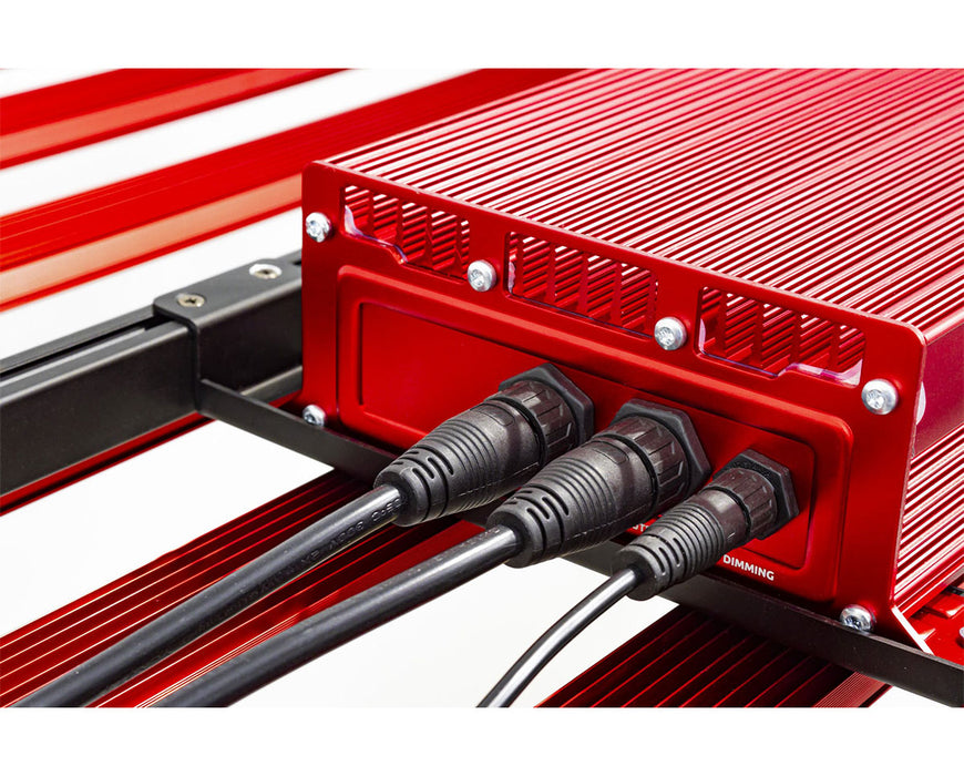 Rear view of the Photontek driver with dimming and power cables plugged into ports.