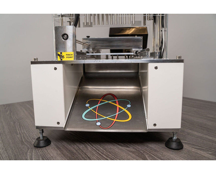 Bottom view of STM Atomic Closer V3 Turbo showing internal logo and pinch point warning label