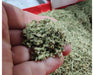 Close-up of finely ground cannabis flower used in STM pre-roll production