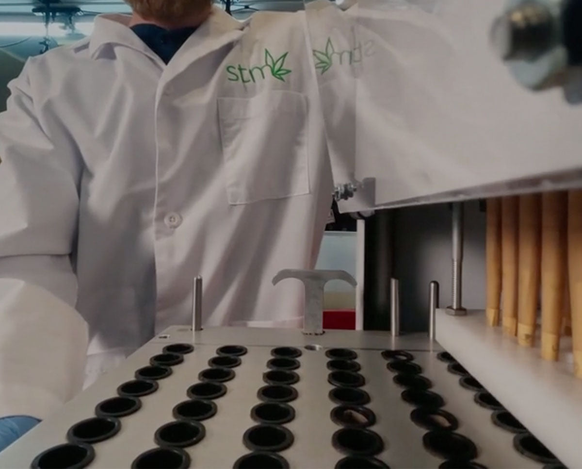 STM Cone Lander cone loading tray preparing to fill 72 pre-roll cones, boosting speed and efficiency in bud workflows.