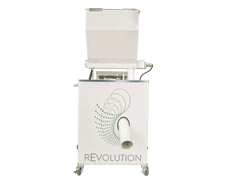 Front view of STM Revolution 2.0 commercial grinder showing discharge chute and branded panel.