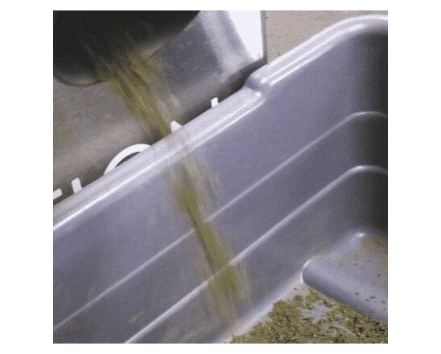 Ground bud flowing from STM Revolution 2.0 grinder chute into a collection bin.