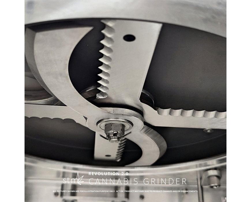 Interior cutting blades of the STM Revolution 2.0 Grinder featuring sharp, serrated edges for precision.