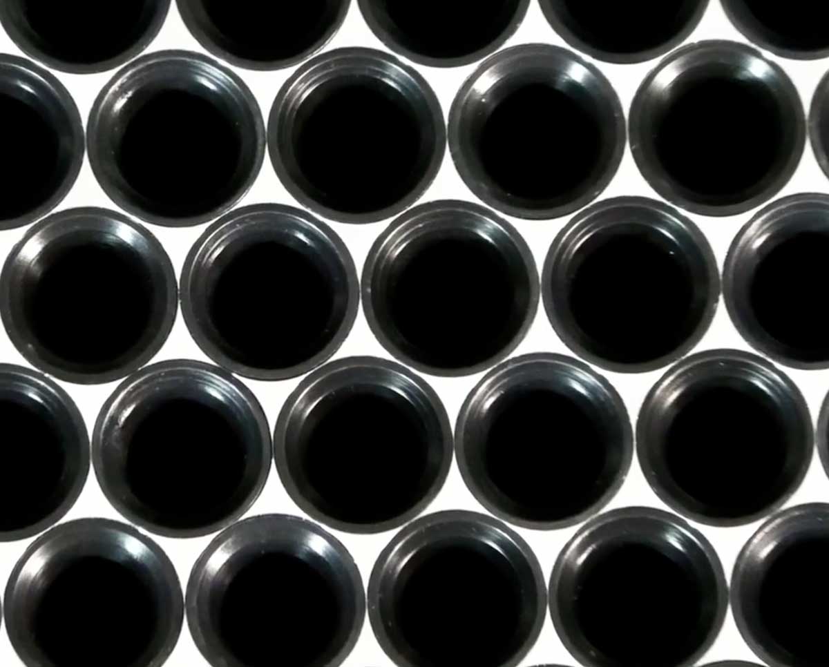 Close-up of STM RocketBox 2.0 tray inserts designed to hold pre-roll cones securely for high-volume automated filling.