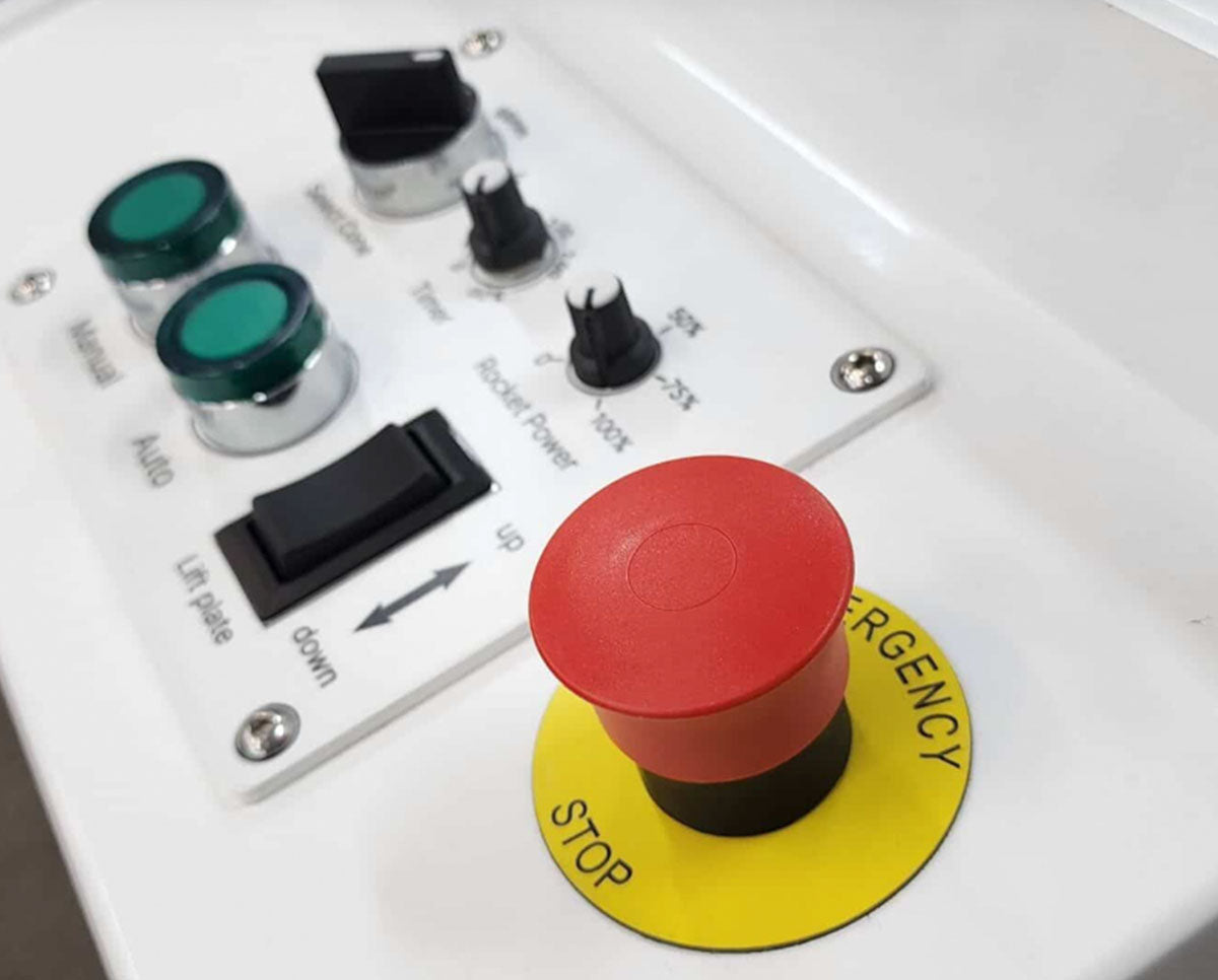 Close-up of STM RocketBox Pro control panel featuring emergency stop, mode settings, timer, and lift plate controls.