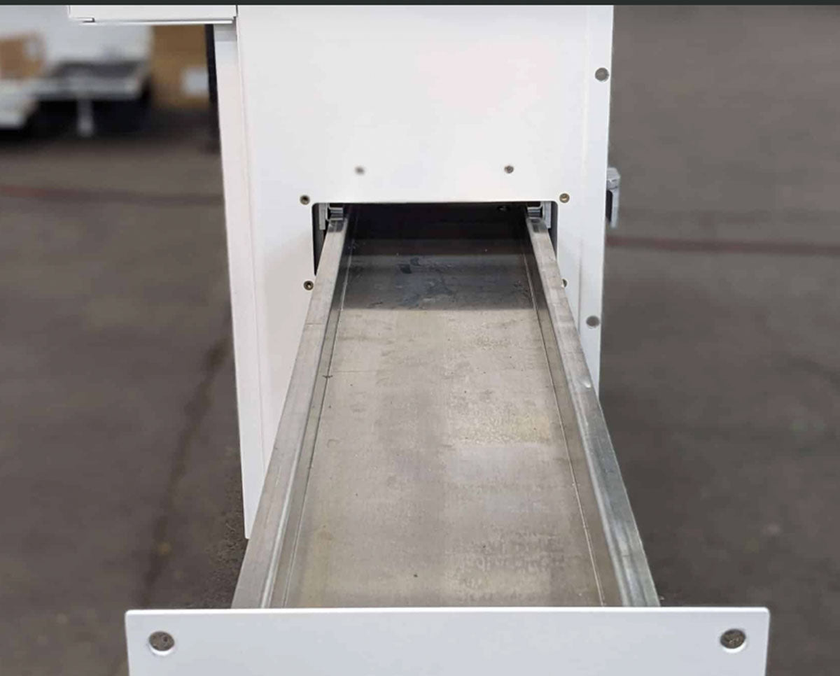 Loading channel of the STM RocketBox Pro pre-roll machine, designed for high-volume cone filling automation.