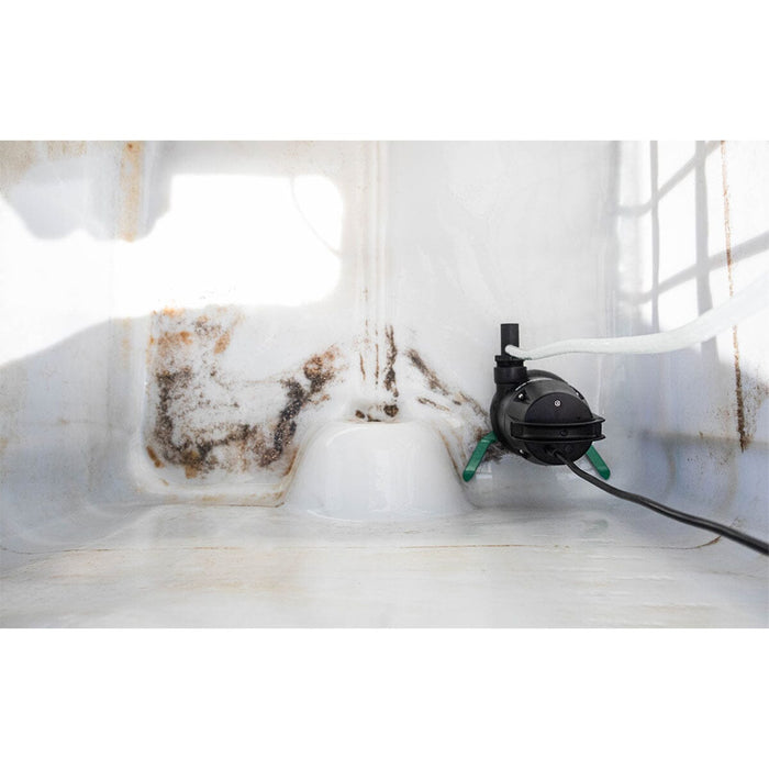 Aeromixer Original pump inside a dirty water tank, showing real-world use and its ability to handle solids and sediment.