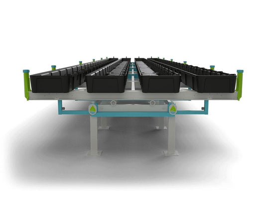 Front view of the Botanicare Slide Bench system with rows of evenly spaced black grow trays on a white and blue powder-coated steel frame. The system is designed for optimized plant spacing and mobility.