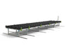 Angled side view of the Botanicare Track Bench System with black trays and green handles on steel sliding rails.