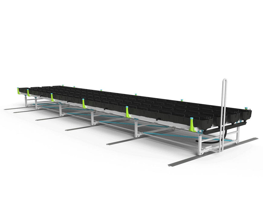 Rear angled view of the Botanicare Track Bench System featuring irrigation infrastructure and long track length.