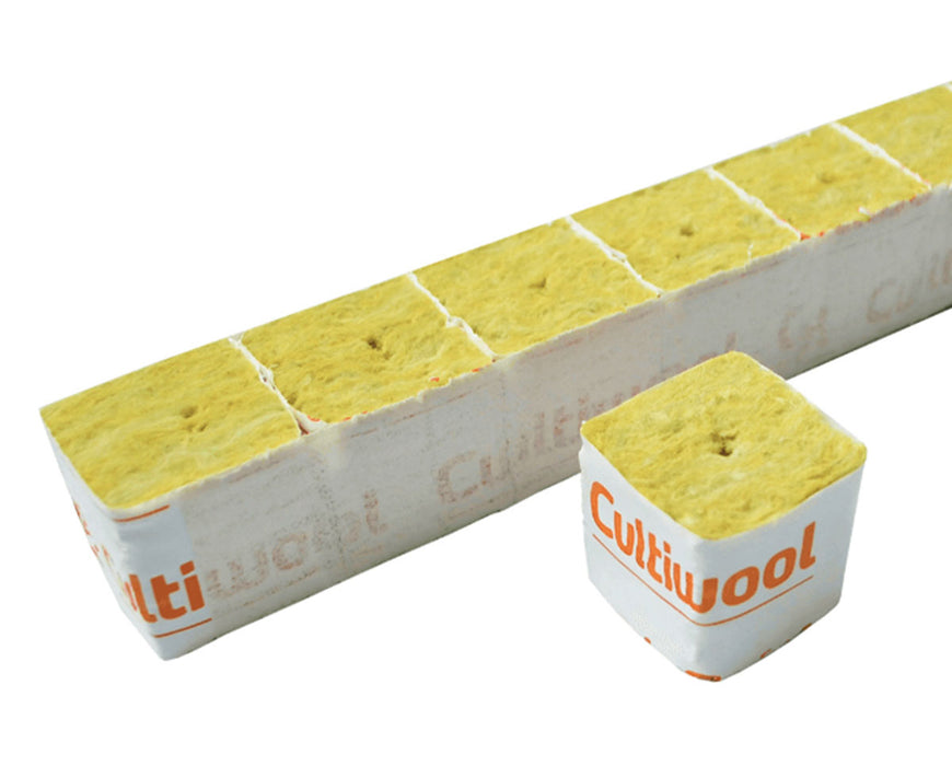 Angled view of a full Cultiwool strip showing multiple connected rockwool cubes in shrink wrap, designed for uniform root development and water retention.