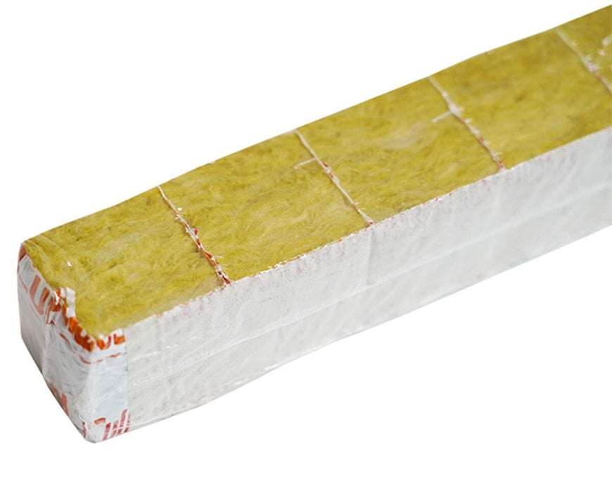 Close-up of individual Cultiwool Mini Clone Blocks, including a separated single cube and a full strip, featuring pre-drilled holes and labeled white wrap for easy transplanting.