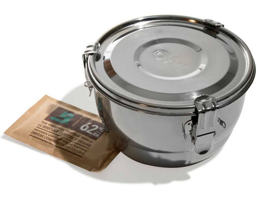 Sealed CVault Grower storage container with triple-latch design and Boveda 62% RH pack beside it, highlighting the airtight construction and embossed lid logo.