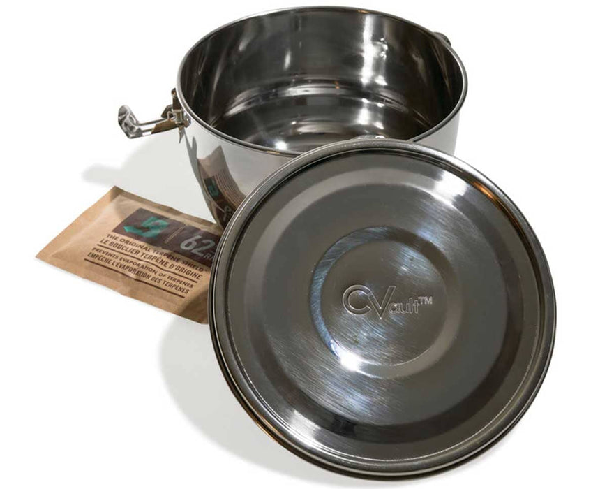 Open CVault Grower stainless steel container with detached lid engraved “CVault” and a Boveda 62% RH humidity pack placed beside it, showcasing the food-grade interior.