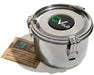 Close-up of a CVault Personal bud storage container made of stainless steel, paired with a Boveda 62% RH humidity pack, highlighting the airtight design and secure latches.