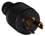 Close-up of NEMA L7-15P twist-lock plug with brass prongs on black industrial-grade casing.