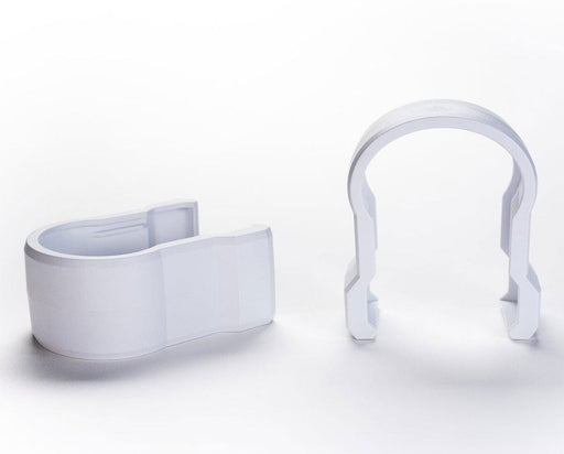 Two white Faven couplings shown side by side, designed for securing under canopy lights.