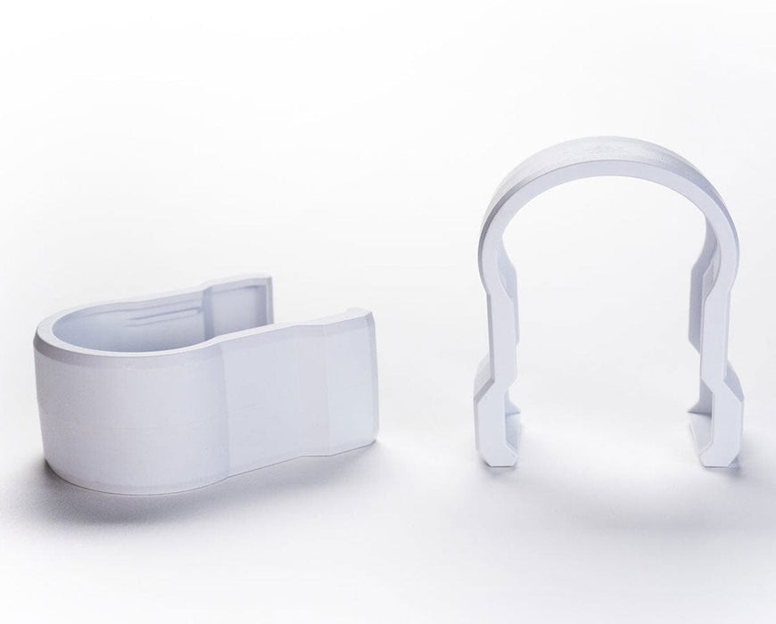 Two white Faven couplings shown side by side, designed for securing under canopy lights.