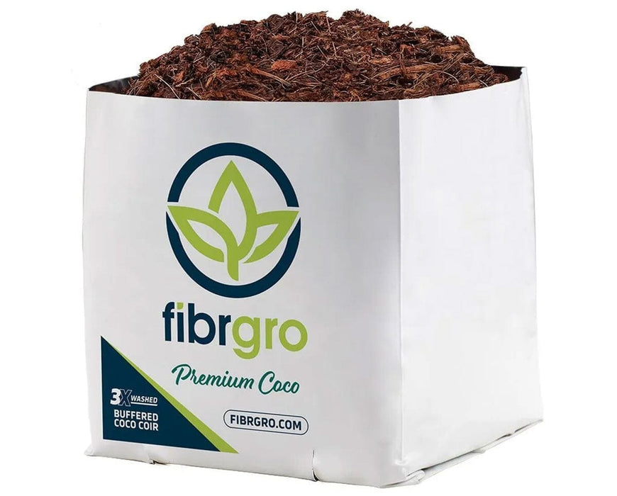 Close-up of a single Fibrgro Premium Coco grow bag filled with a 40/60 coir chip and fine coco pith blend, wrapped in a white branded sleeve with visible rich brown coco media.
