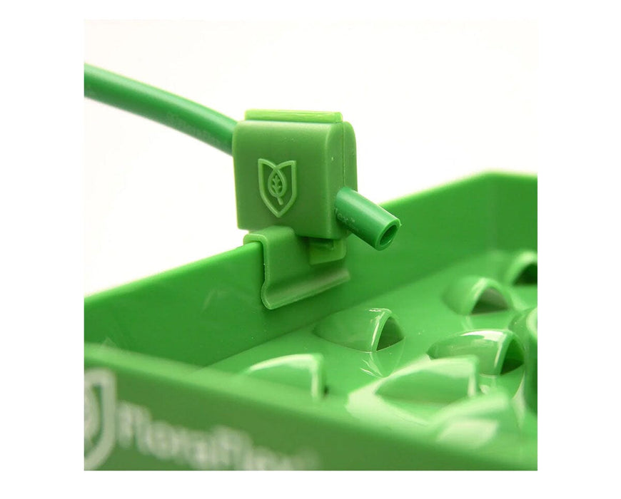 FloraFlex FloraClip dripper attached to PotPro system for precise irrigation control and tubing connection.