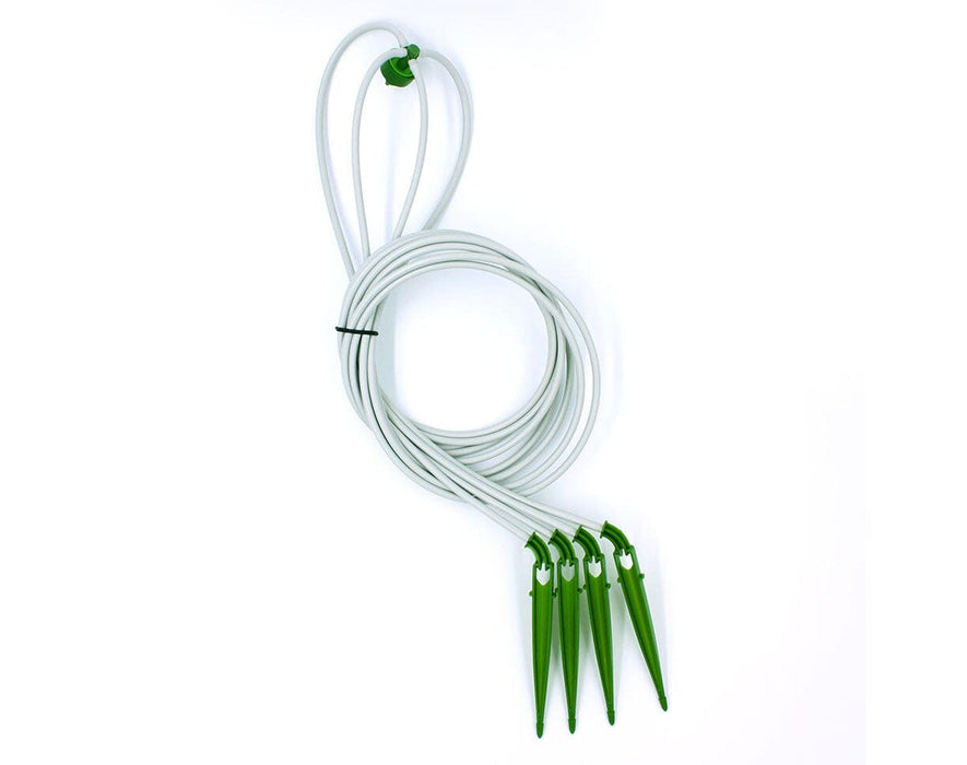 Coiled FloraFlex 4-Way Assembly showing green emitter and four connected tubing lines with drippers.