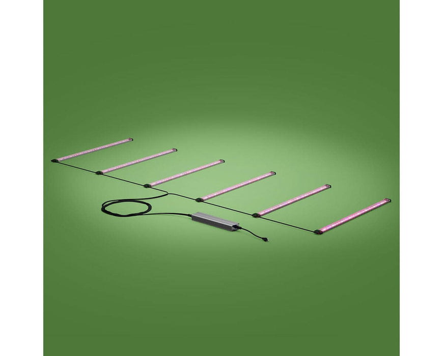 Six FloraFlex LED bars with visible far-red light, wired to a single 720W power supply on green background.