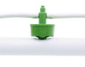 Close-up of green FloraFlex emitter connected to 16-17mm white irrigation tubing.
