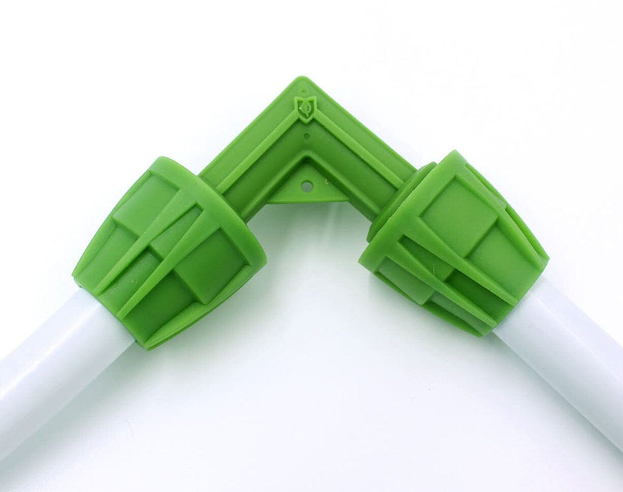 FloraFlex elbow fitting connecting two sections of 16-17mm double-layer tubing with green threaded connectors.