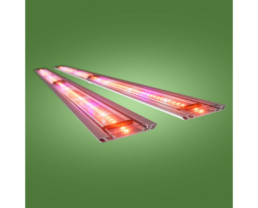 Angled view of powered FloraFlex far-red retrofit bars showing vivid red and pink diode output.