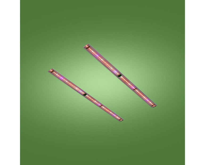 Two FloraFlex retrofit LED bars powered on with far-red glow against green background.