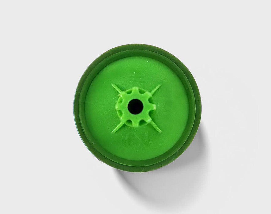 Bottom view of FloraFlex 1/2 GPH emitter showing precision outlet nipple design.